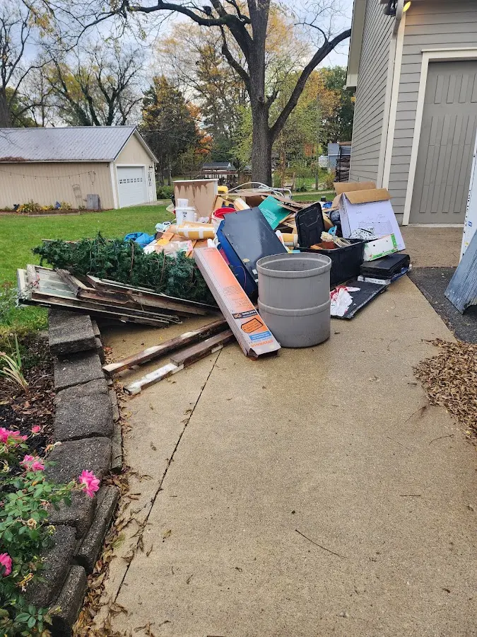 Dumpster being loaded with debris for Roofing Dumpster Rental in Sun Village